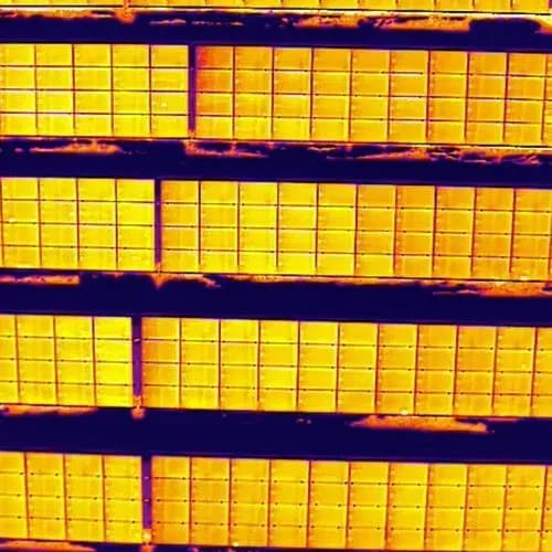 Thermal close-up of a solar module Thermal image of solar module cell strings in yellow and orange tones